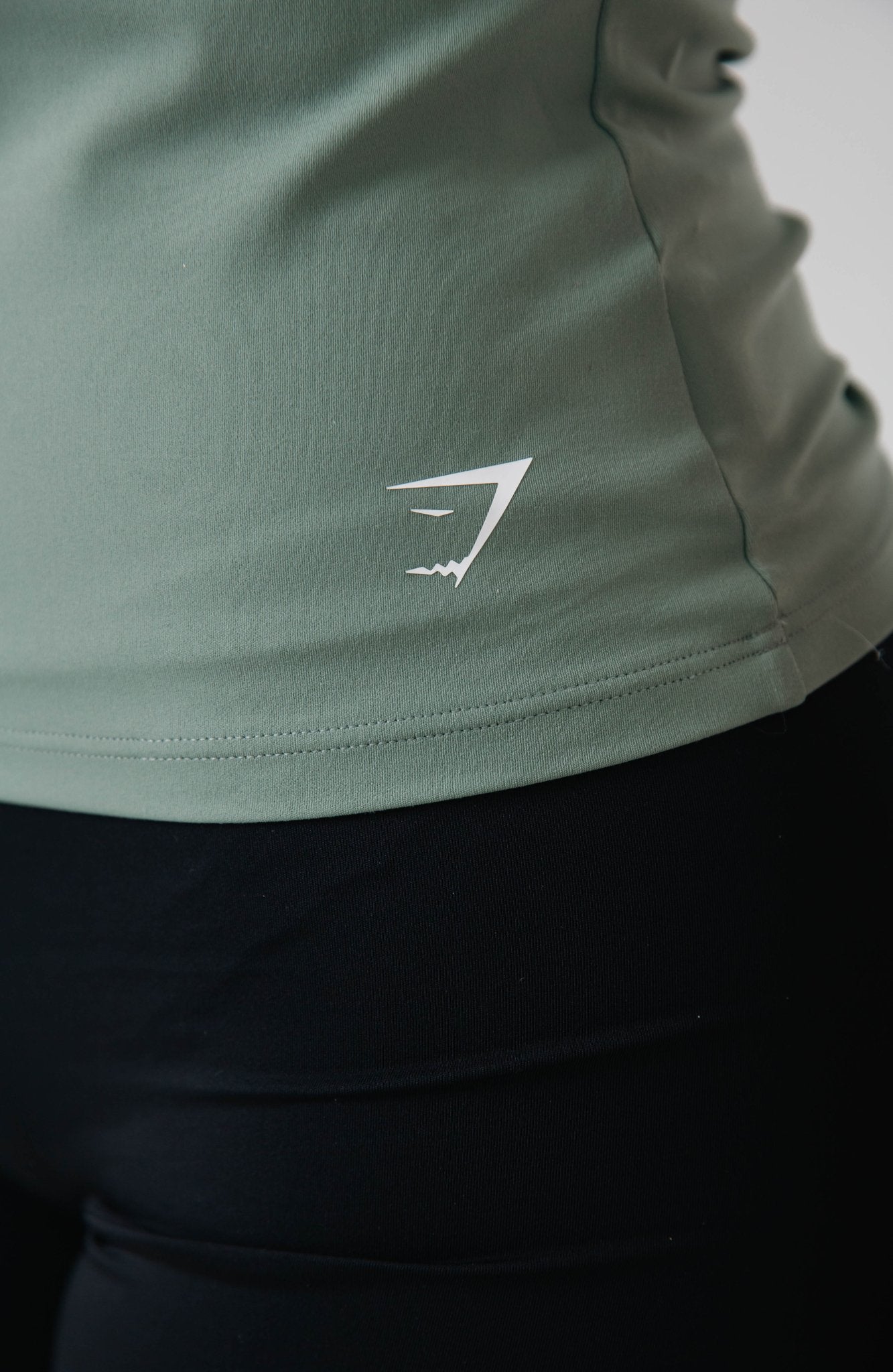 Gymshark Green Asymmetric Shelf Tank - GYM THREADS